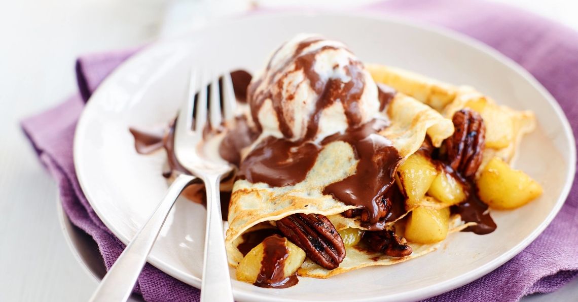 Caramelised pear and salted pecan filled pancakes with hot chocolate sauce