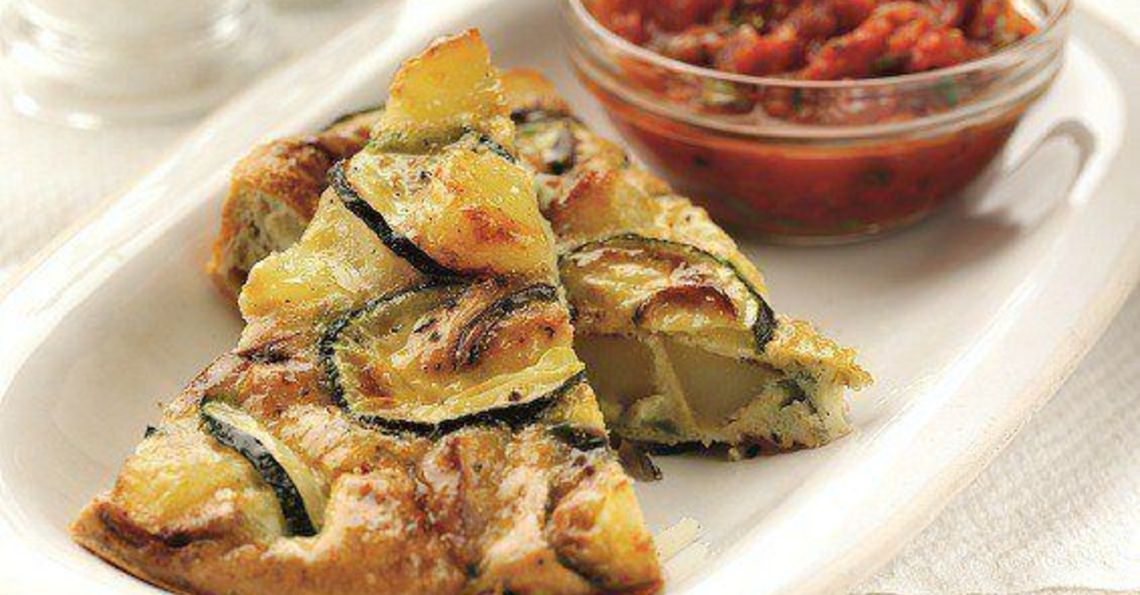 Spanish tortilla with spicy tomato sauce