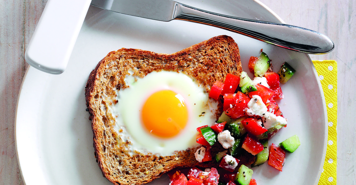 Egg in a toast with tomato and feta