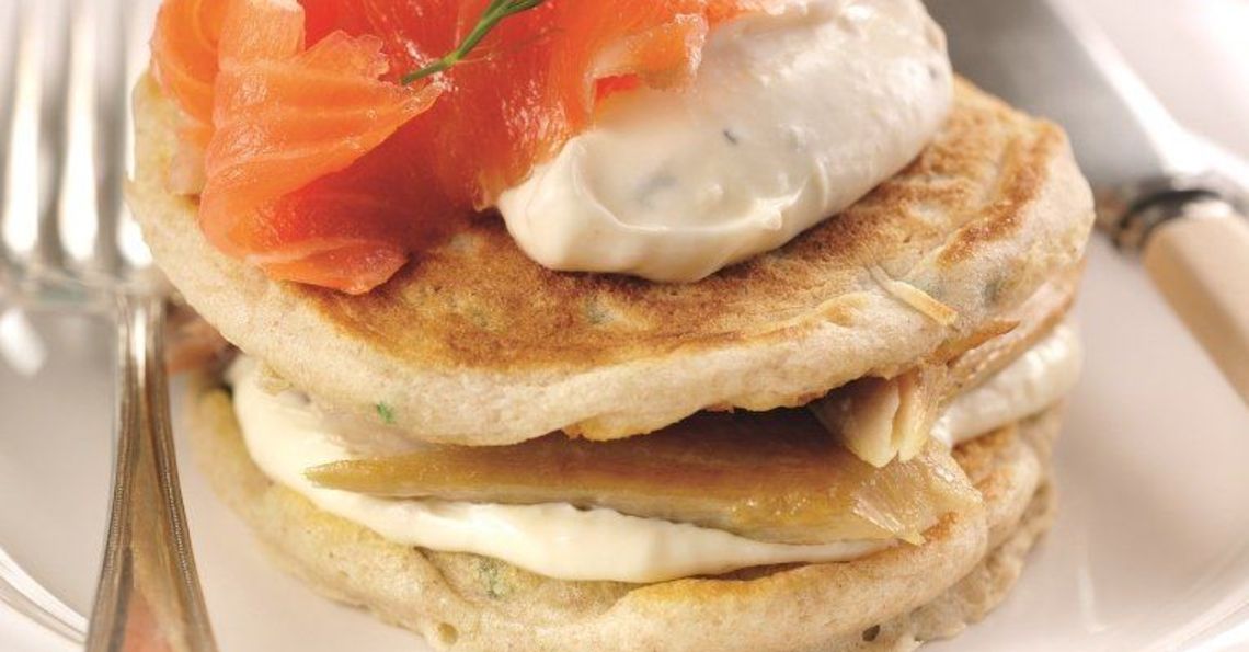 Giant Russian blinis with horseradish, mackerel and salmon topping