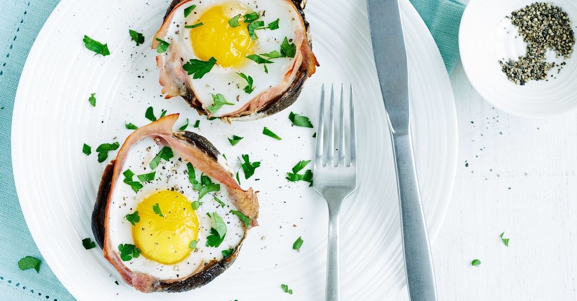 Baked eggs and ham in Portobello mushrooms