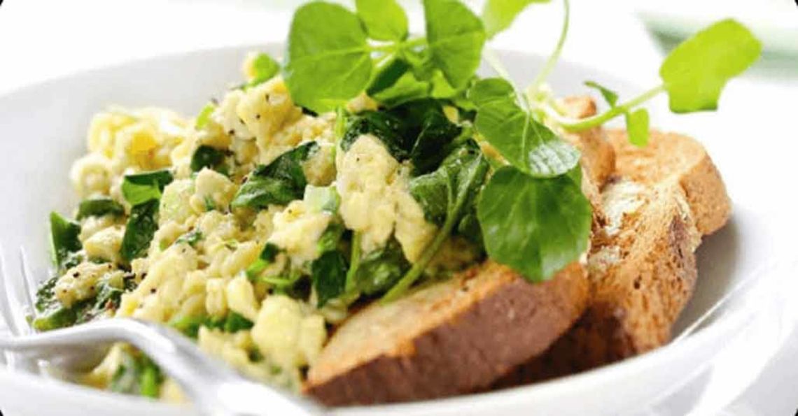 Scrambled eggs with watercress