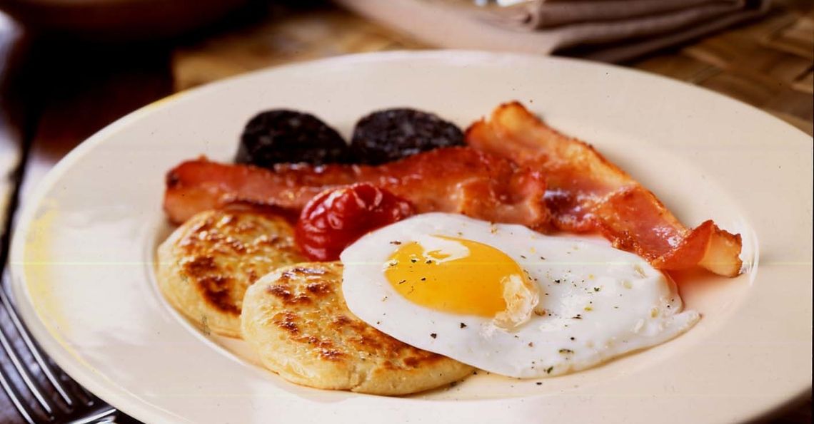 Pancakes with eggs, bacon, black pudding