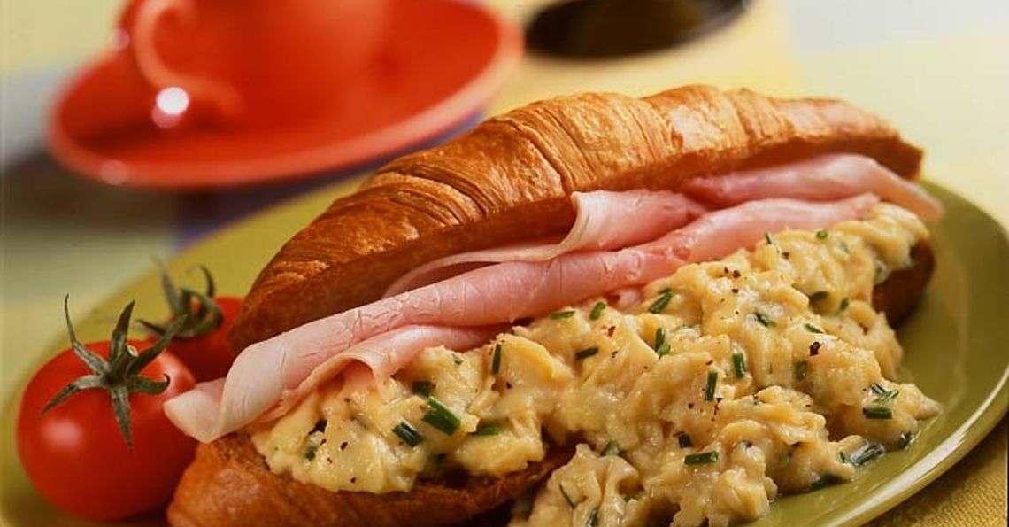 Scrambled eggs on croissant