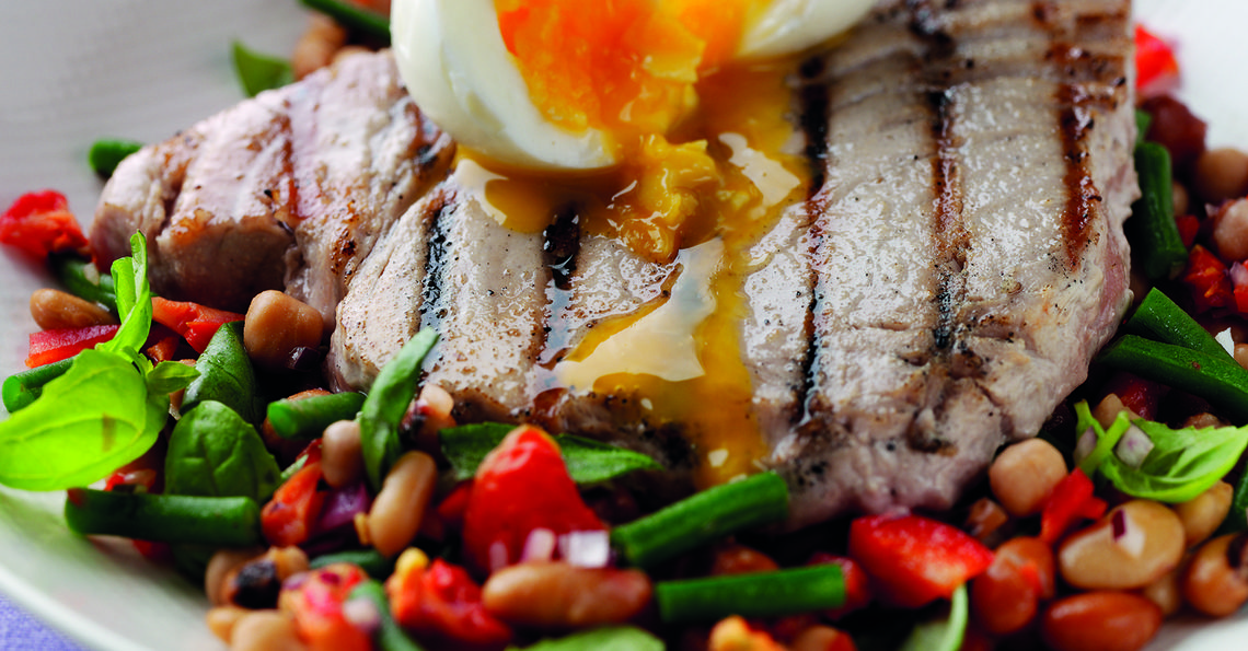 Seared tuna steak with three-bean salad and a soft boiled egg