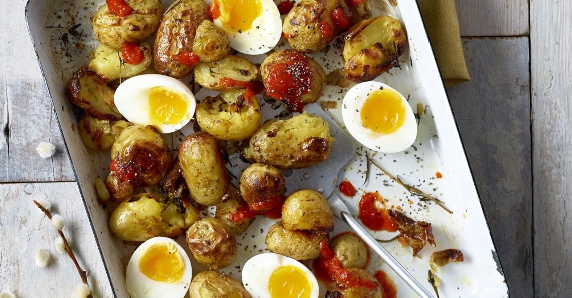 Crispy breakfast potatoes with soft boiled eggs
