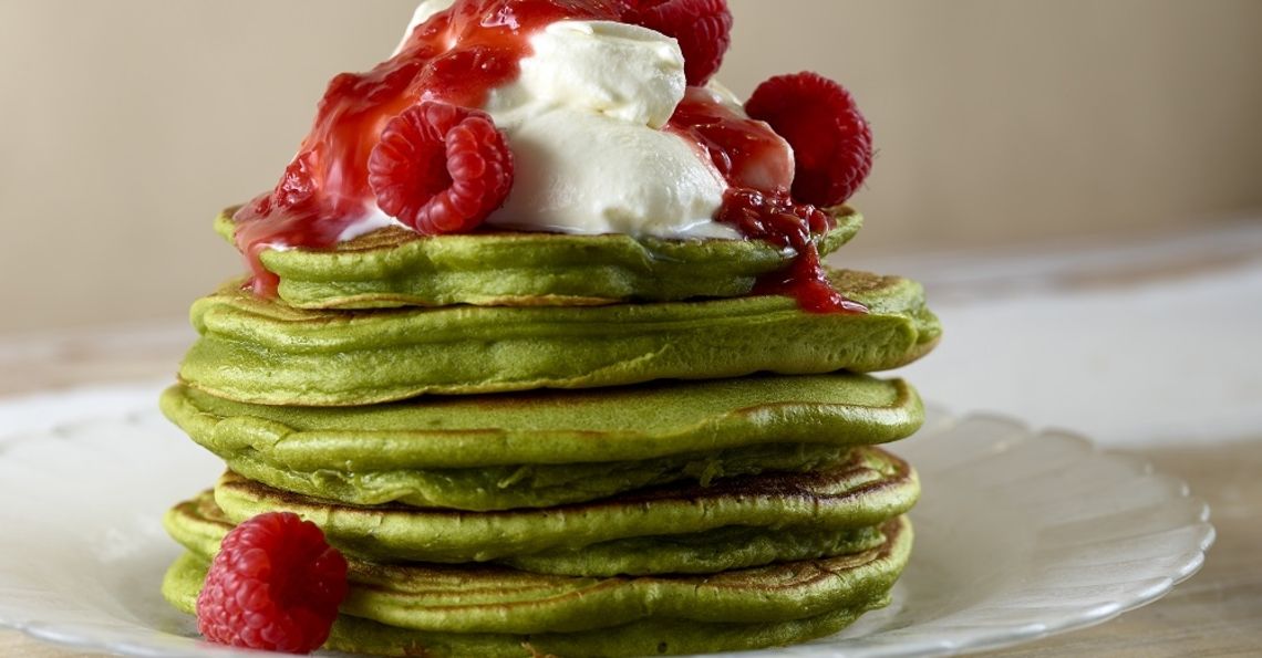Super green matcha pancakes, coconut cream and raspberries