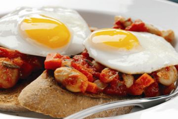 Homemade beans with lightly fried eggs