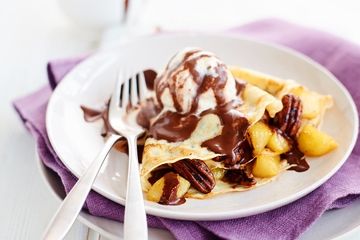 Caramelised pear and salted pecan filled pancakes with hot chocolate sauce