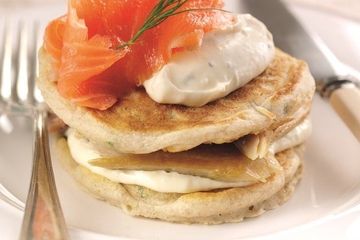 Giant Russian blinis with horseradish, mackerel and salmon topping