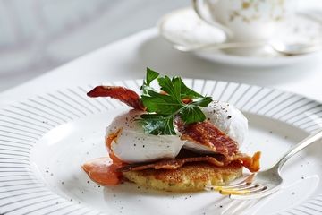 Soft poached eggs with sweetcorn pancake and crispy pancetta