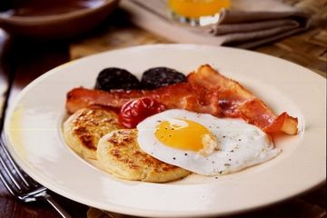 Pancakes with eggs, bacon, black pudding