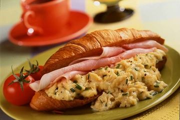 Scrambled eggs on croissant