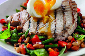 Seared tuna steak with three-bean salad and a soft boiled egg