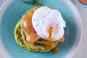 Spinach and dill pancakes with salmon and eggs